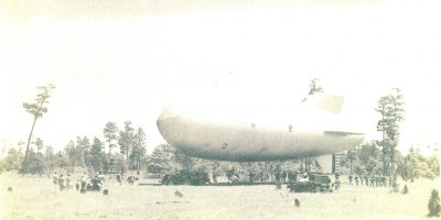 One of the observation blimps pictured with its ground crew.